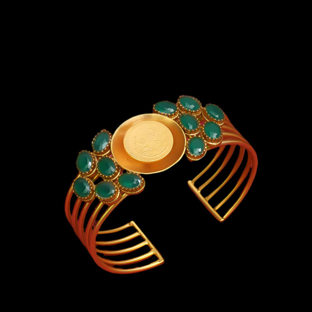 Suhani Pittie Gold coin centre hand cuff with green crystals