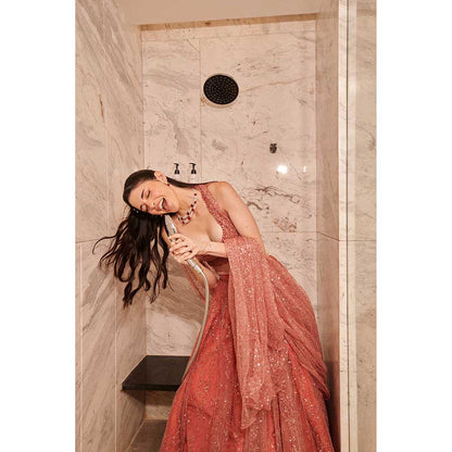 Jigar and Nikita Coral Rose Dust Drape Attached Blouse with Lehenga (Set of 2)