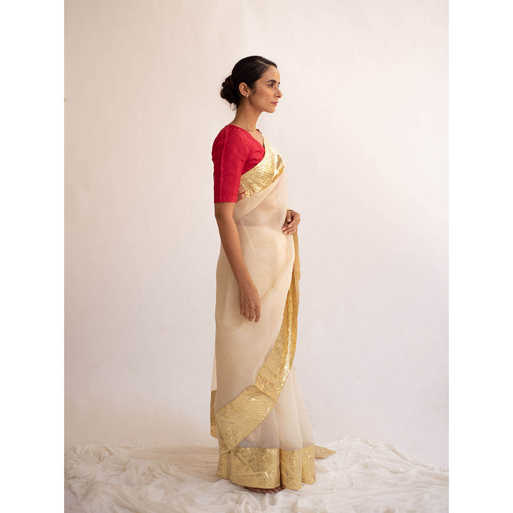 KAPARDARA A Pure Silk Organza Saree In The Shade Of Cream Handcrafted With Gold Lampe Border