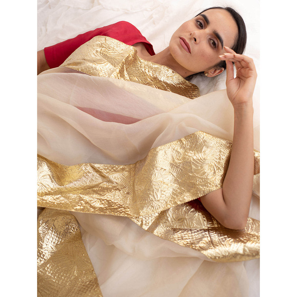 KAPARDARA A Pure Silk Organza Saree In The Shade Of Cream Handcrafted With Gold Lampe Border