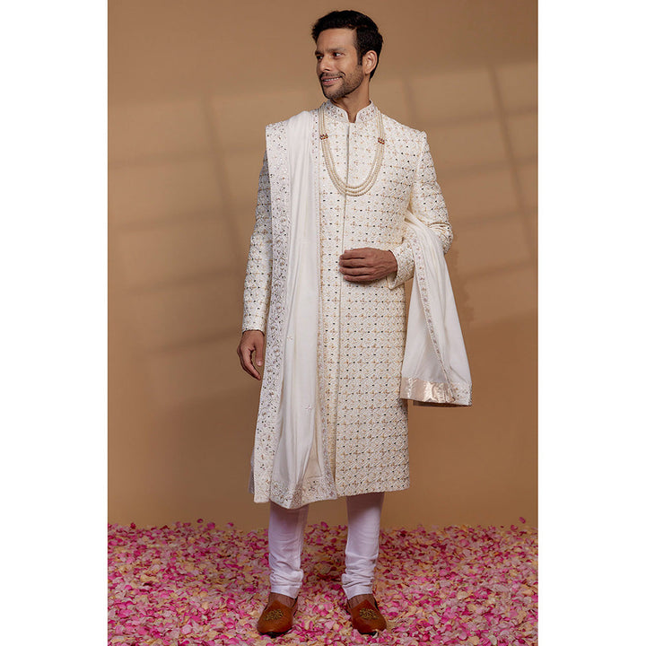 RIYAASAT Ivory Raw Silk Sequin Embellished Sherwani with Churidar and Shawl (Set of 3)