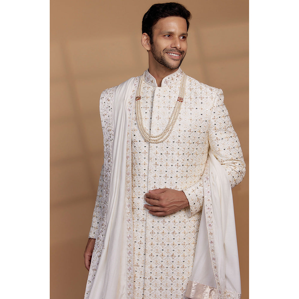 RIYAASAT Ivory Raw Silk Sequin Embellished Sherwani with Churidar and Shawl (Set of 3)