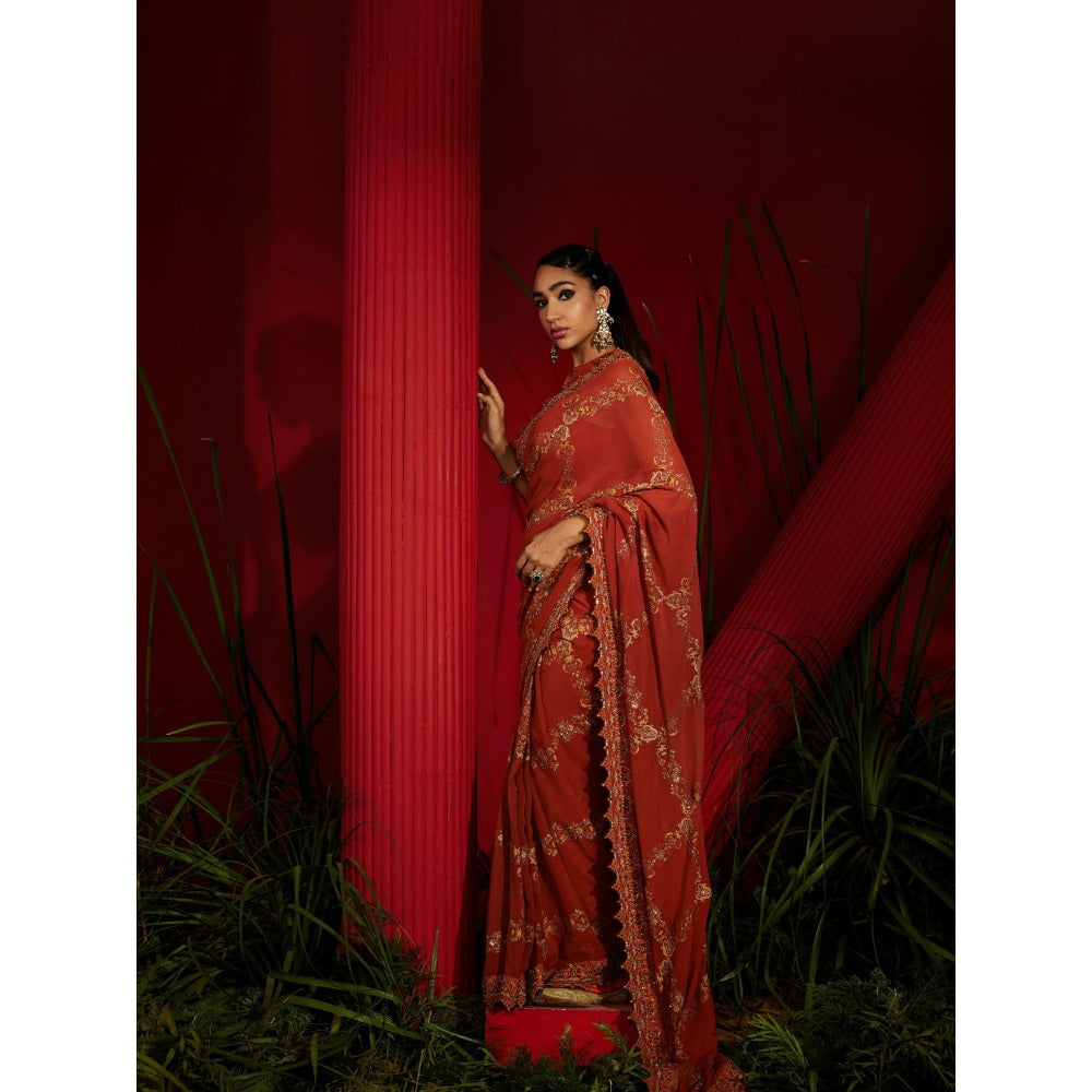 Shreeka Rust Saree In Georgette Silk Paired With Matching Stitched Blouse And Petticoat