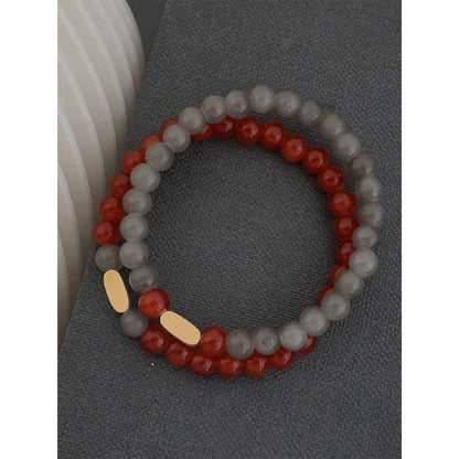 Suhani Pittie Gold Plated Oval Motif With Red & Grey Glass Beads Distance Bracelet (Set Of 2)