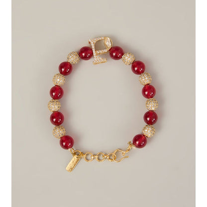 XAGO Aarav Rakhi - Polki Monogram Rakhi With Red Beads and Crystal Accents