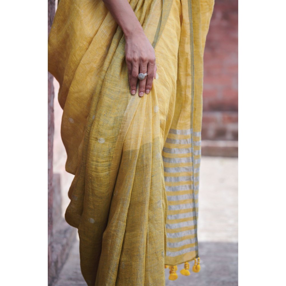 Dressfolk multi toned handwoven yellow saree with detailed jamdani work and silver zari buttas.