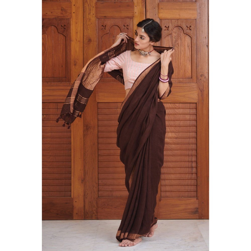 Dressfolk Deep maroon linen handwoven saree with gorgeous golden zari.