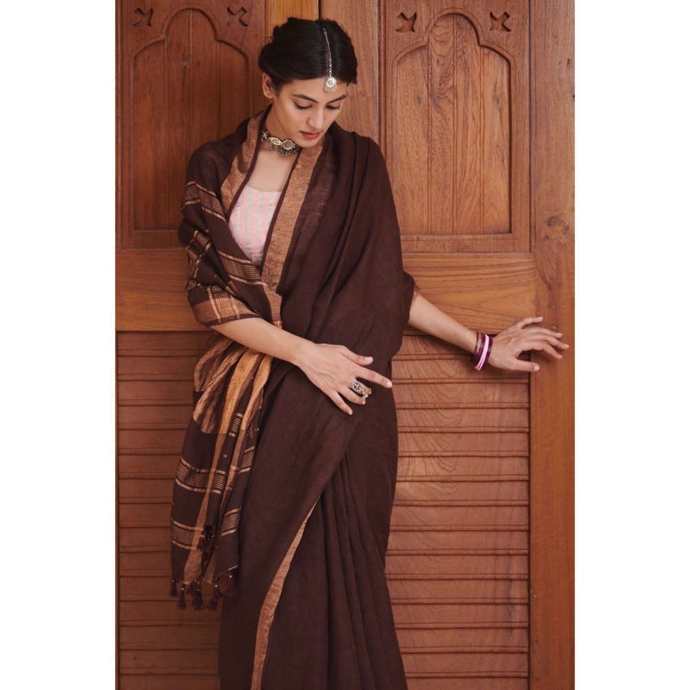 Dressfolk Deep maroon linen handwoven saree with gorgeous golden zari.