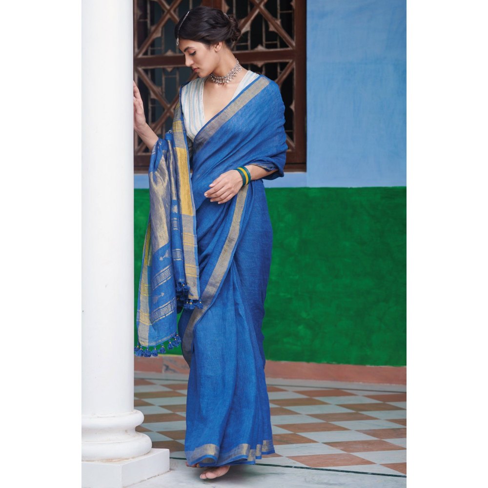 Dressfolk Indigo Saree: Tradition meets style with gold zari and self-colored tassels.