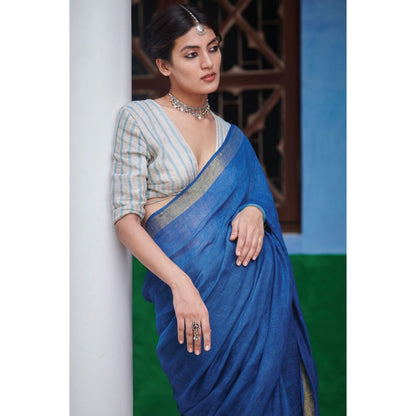 Dressfolk Indigo Saree: Tradition meets style with gold zari and self-colored tassels.