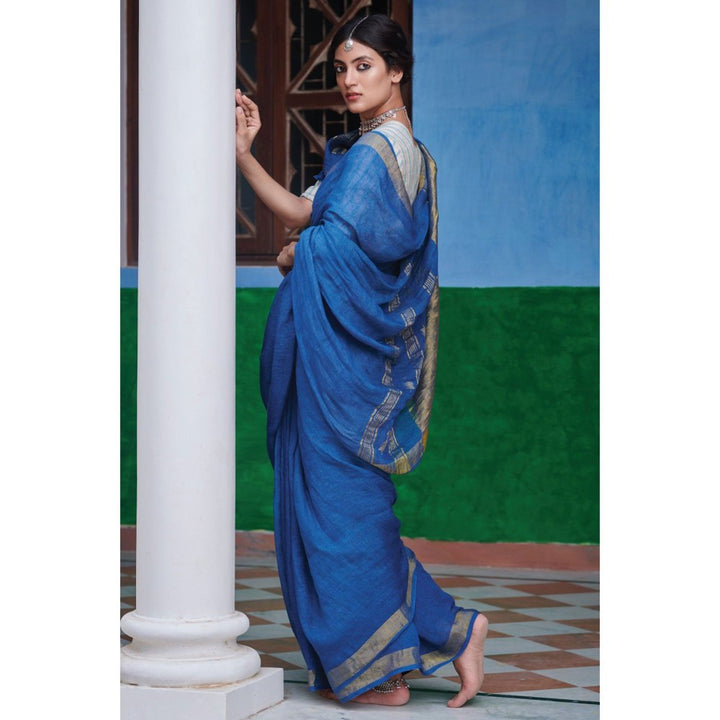 Dressfolk Indigo Saree: Tradition meets style with gold zari and self-colored tassels.