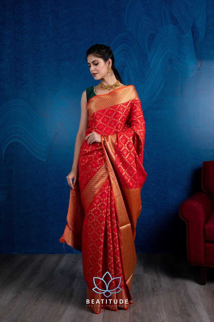 Beatitude Red Gold-Toned Zari Silk Blend Patola Saree with Unstitched Blouse