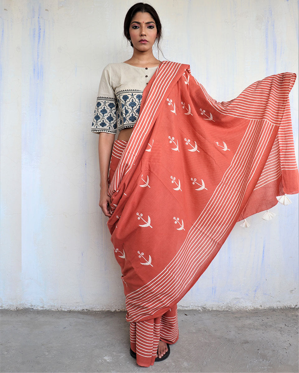 Chidiyaa Rust Block Printed Cotton Mul Saree God with Unstitched Blouse