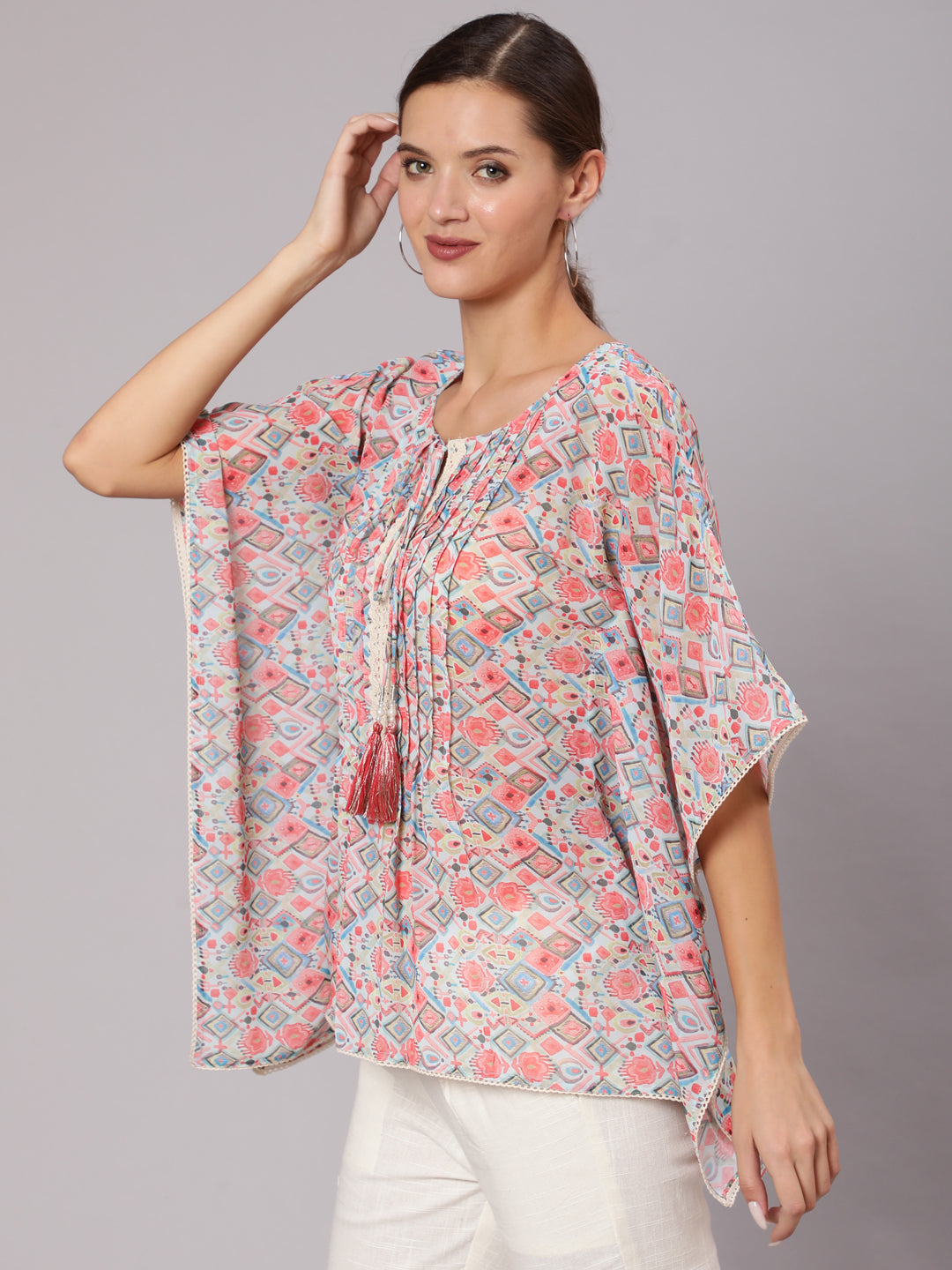 Peach Geometric Printed Georgette Kaftan Top With Pintucks And Lace Details At The Yoke for women online at Jaipur Kurti