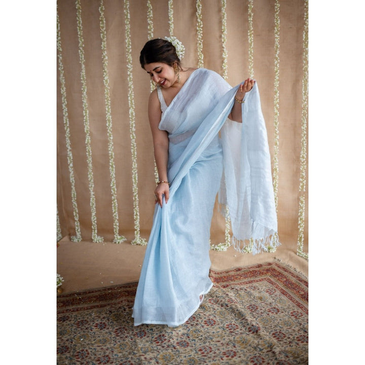 The Indian Ethnic Co. Blue Linen Silver Zari Border Saree & Unstitched Blouse with Mukaish Detailing